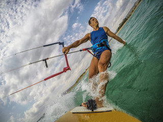 Young man practice kitesurfing. Action camera on board view © nnerto