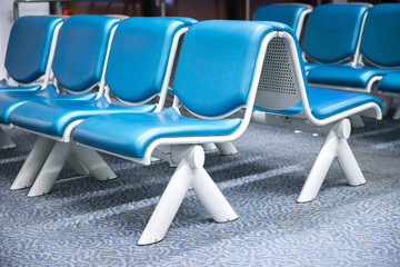 Fototapeta premium Empty seats,Blue airport seat in waiting area