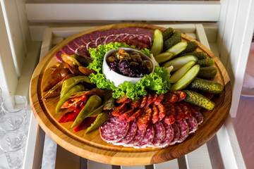 Cutting of sausages and sausages. Caviar in the basket