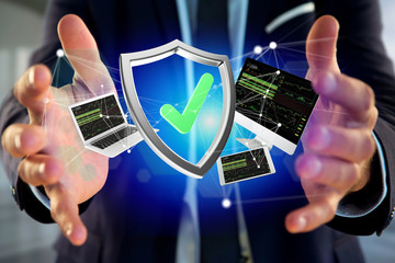 Shield symbol surrounded by devices and network displayed on a futuristic interface