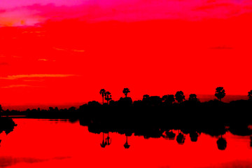 Fototapeta na wymiar Sunset behind the pond.