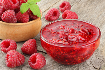 healthy food. raspberry with raspberry jam on old wooden background