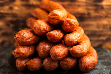 Stack of deliciously smoked handmade Swedish Isterband sausages with natural casing.