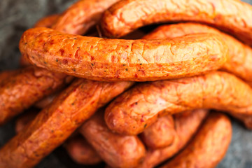 Fototapeta premium Large pile of deliciously smoked handmade Swedish Isterband sausages with natural casing.