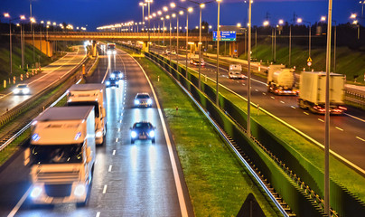 Fototapeta na wymiar Trucks on four lane controlled-access highway in Poland