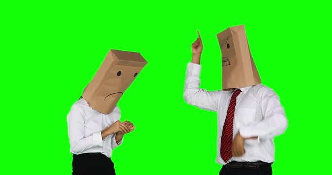 Angry anonymous businessman with paper bag on his head, scolding his anonymous female worker. Shot in 4k resolution with green screen background