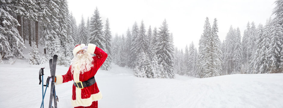 Santa Claus Skier On The Background Of The Ski Landscape. Vacation In Winter In The Mountains For Christmas.