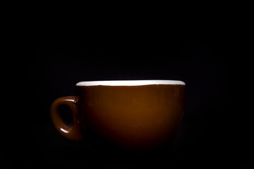 A big coffee cup on black background.
