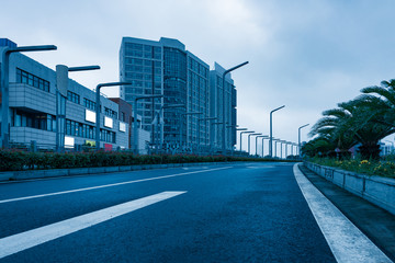 Fototapeta na wymiar empty road with modern buildings on background,shanghai,china.