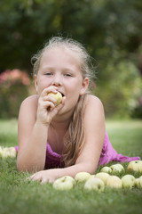 Nice young girl eating apple