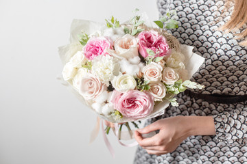 Mix flowers. Luxury bouquets in the girl's hands