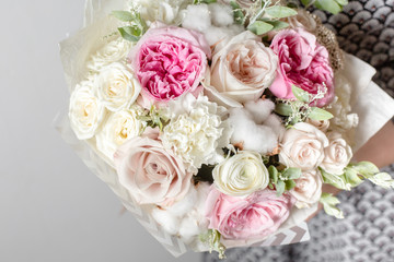 Mix flowers. Luxury bouquets in the girl's hands