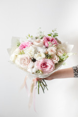 Mix flowers. Luxury bouquets in the girl's hands