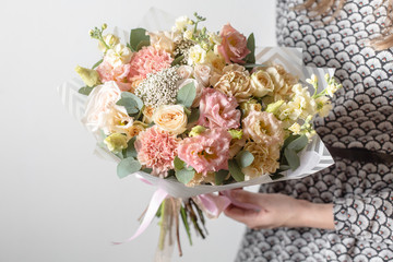 Mix flowers. Luxury bouquets in the girl's hands