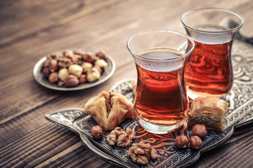 Cup of turkish tea served in traditional style - obrazy, fototapety, plakaty