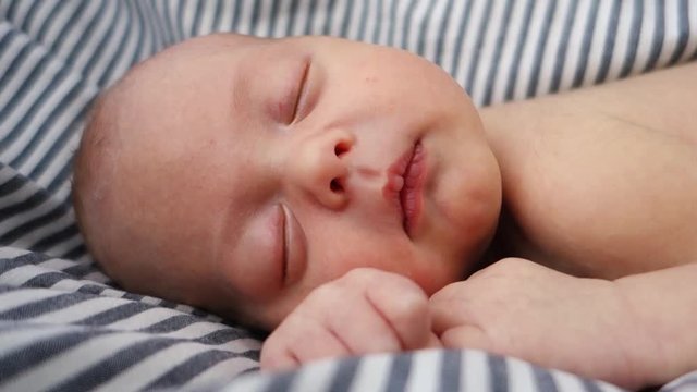 Face of a newborn baby sleeping close up