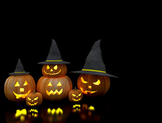 halloween carved pumpkin with witch hat in the black room