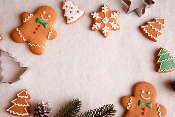 beautiful Christmas background with gingerbread men, Christmas trees and snowflakes with pine cones