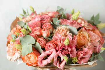 Flower composition on a gray background. Wedding and Festive decor. Powdery pink color.