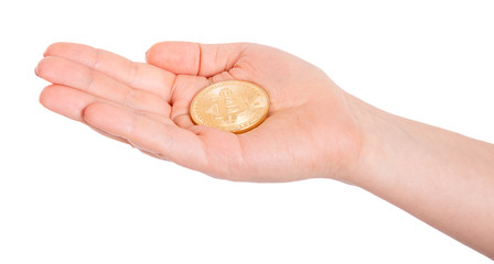 Golden Bitcoin in a man hand. Digitall symbol of a new virtual currency.