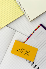25 Percent; Many Notebooks on the Working Table