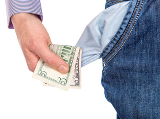 man taking five dollars out of a pocket jeans