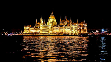 Fototapeta premium Budapest Parliament in Hungary at night on the Danube river.