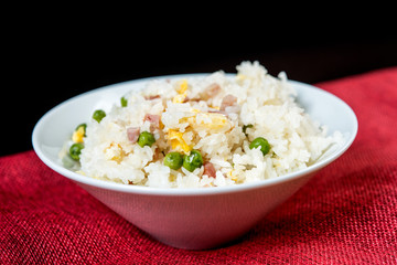 Homemade Chinese fried rice with vegetables and fried eggs