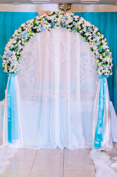 Wedding decor .Arch for carrying out of painting . beautiful wedding feather