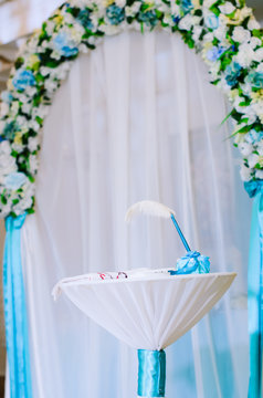 Wedding decor .Arch for carrying out of painting . beautiful wedding feather