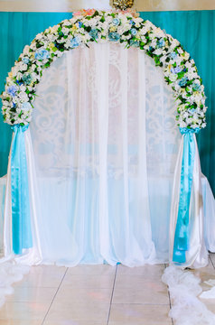 Wedding decor .Arch for carrying out of painting . beautiful wedding feather