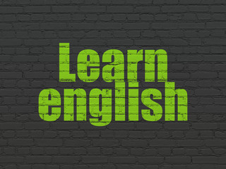 Studying concept: Learn English on wall background