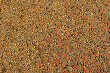 A rubber sidewalk filled with dirt