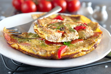 Omelet with eggs, tomato and dill on rye bread