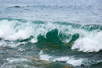 Storm wave on the coast of the Arctic. Barents sea, Russia.