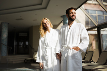 Portrait of attractive couple in spa center