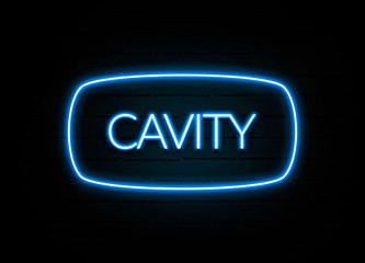 Cavity  - colorful Neon Sign on brickwall