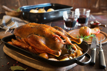 Roast Christmas duck with apples