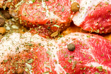 fresh raw meat on wooden cutting board