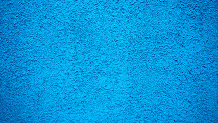 Obraz premium Blue wall stucco vintage style background. Painted surface, an old concrete building in city.