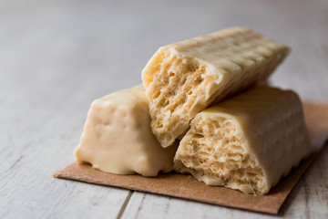 White Chocolate Wafer on wooden surface.