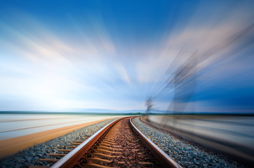 Motion on railroad bridge curve track over the lake, Blue Sky