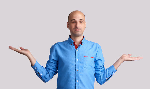 bald man making dont know gesture