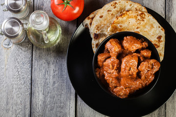Chicken tikka masala served with bread naan