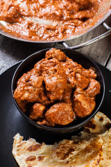 Chicken tikka masala served with bread naan