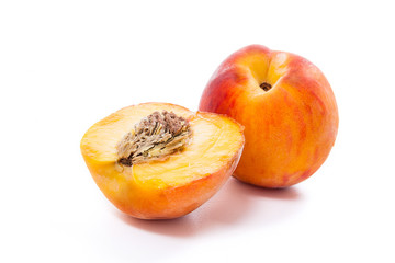 Naklejka na ściany i meble Ripe peach fruit and a half isolated on white background.