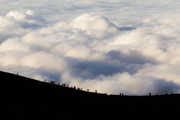 Tourists walking on the steep trail to Sulfur Mines on Ijen volcano, East Java.