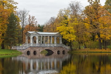 Autumn forest in Pushkin, marble bridge, Saint-Petersburg, Russia