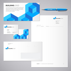   Blue brick building logo. Identity and logo. Blank, envelope, card, business cards.