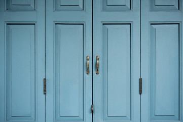 Background and texture of antique blue wooden door.